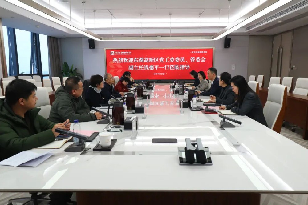 汤建接待东湖高新区管委会副主任钱德平